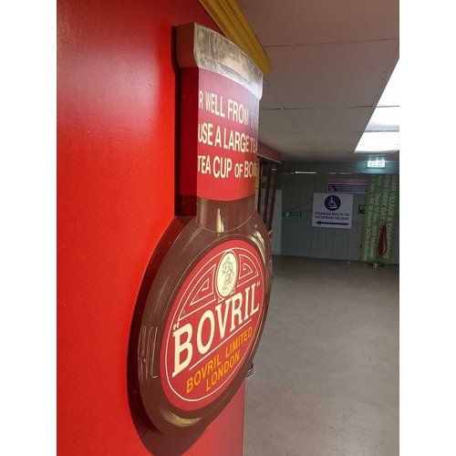 1021 - ± Bovril A wall relief Bovril advertising bottle relief 107x81x15cm. - This lot will be subject to a... 