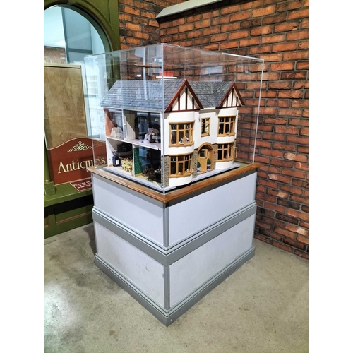 1087 - ± Entrance Dolls House A large model Dolls house with display case and stand Height overall 171 cm D... 