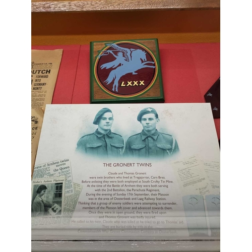 1176 - ± The War Gallery Arnhem The Arnhem display case contents to include,Parachute Regiment flag, unifor... 