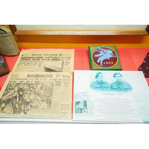 1176 - ± The War Gallery Arnhem The Arnhem display case contents to include,Parachute Regiment flag, unifor... 