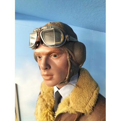 1180 - ± The War Gallery WW2 flying jacket etc A standing figure of a WW2 pilot wearing period flying jacke... 