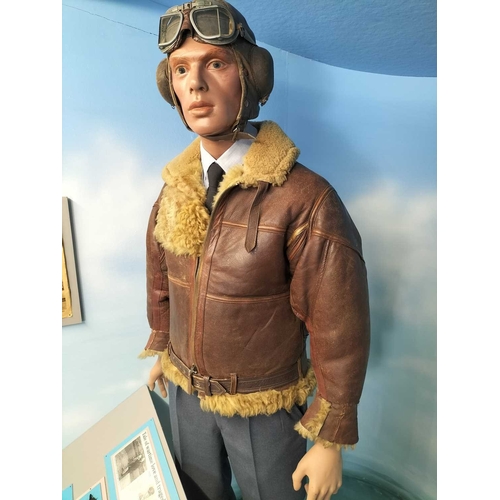 1180 - ± The War Gallery WW2 flying jacket etc A standing figure of a WW2 pilot wearing period flying jacke... 