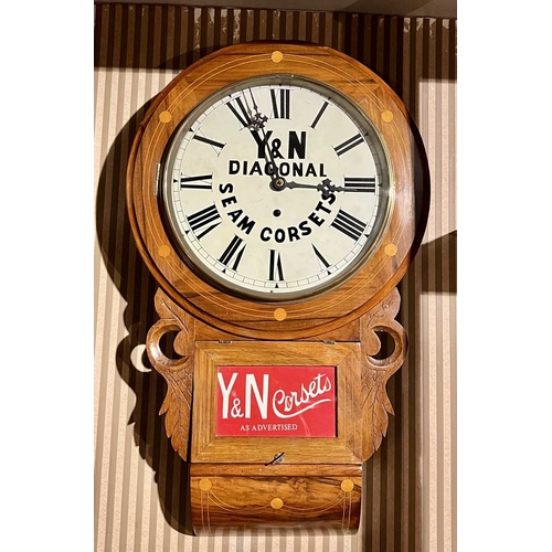 297 - ± Corsetiere Miss Penrose Clock A single train drop case wall clock advertising Y&N Corsets This clo... 