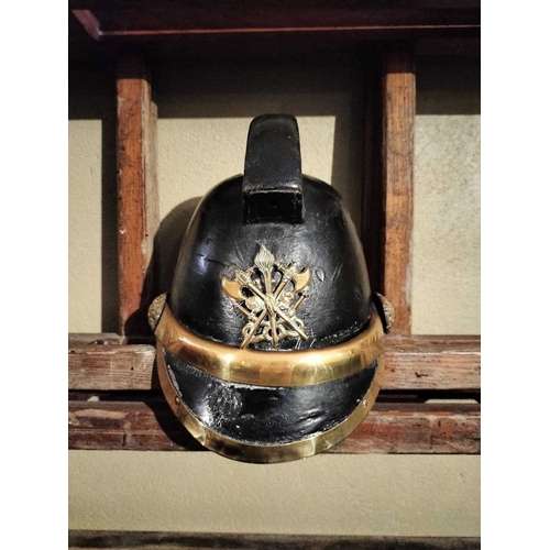 308 - ± Flambards Fire Station Six items from the Fire Station A leather and brass fireman's helmet, a lea... 