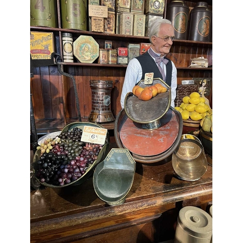 359 - ± Birch, Birch & Co Grocers Display hods Two toleware shop display hods with original decoration and... 