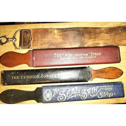 380 - ± E Thomas Gentleman's Hairdresser Shaving Strops Four shaving strops including Taylor's Sheffied, T... 