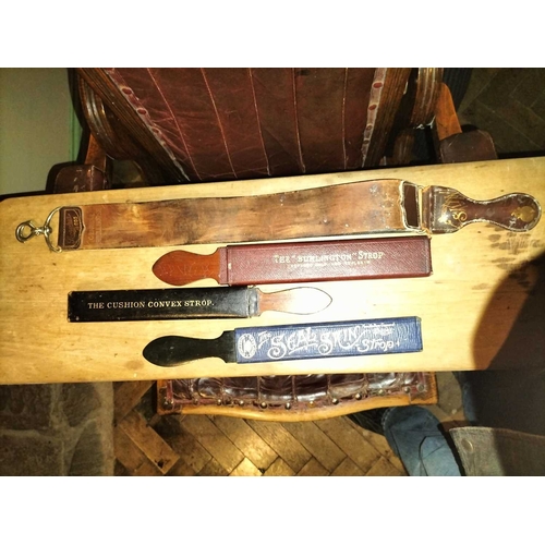 380 - ± E Thomas Gentleman's Hairdresser Shaving Strops Four shaving strops including Taylor's Sheffied, T... 