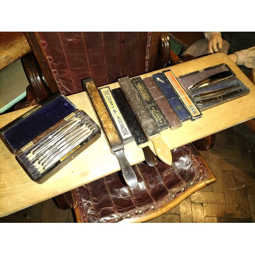 383 - ± E Thomas Gentleman's Hairdresser Razors and Strops A collection of Razors and Strops including a p... 