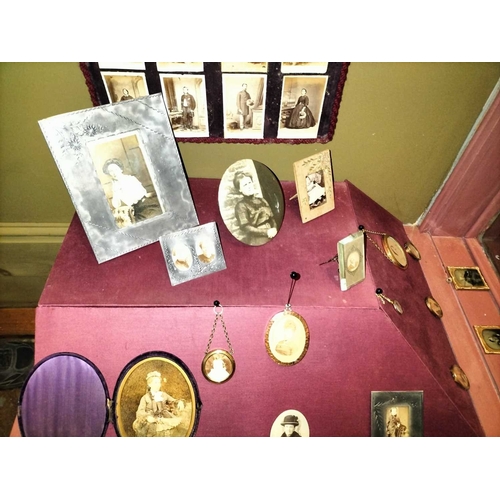 462 - ± Maggs Photographer Display of framed portraits The right-hand shop window display of framed portra... 