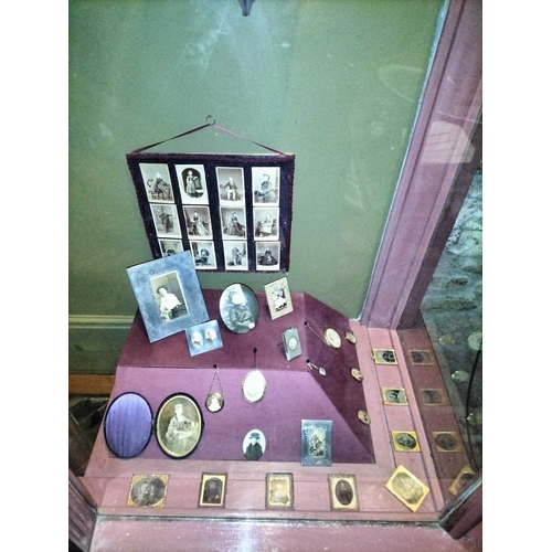 462 - ± Maggs Photographer Display of framed portraits The right-hand shop window display of framed portra... 