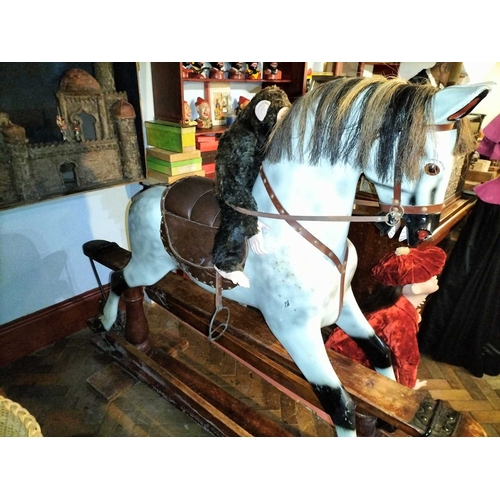 484 - ± Mr Neville's Toyshop A good large carved and painted Rocking Horse A large good early C20th carved... 