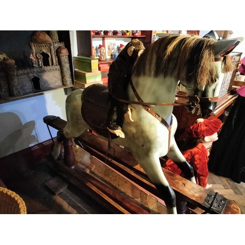 484 - ± Mr Neville's Toyshop A good large carved and painted Rocking Horse A large good early C20th carved... 