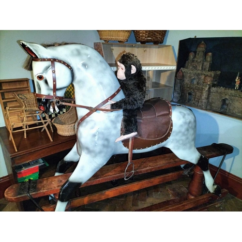 484 - ± Mr Neville's Toyshop A good large carved and painted Rocking Horse A large good early C20th carved... 