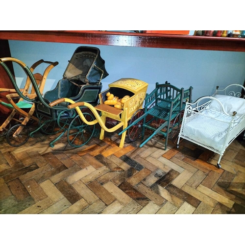 510 - ± Mr Neville's Toyshop Childs Pram and three other wheeled toys An interesting early painted wood an... 