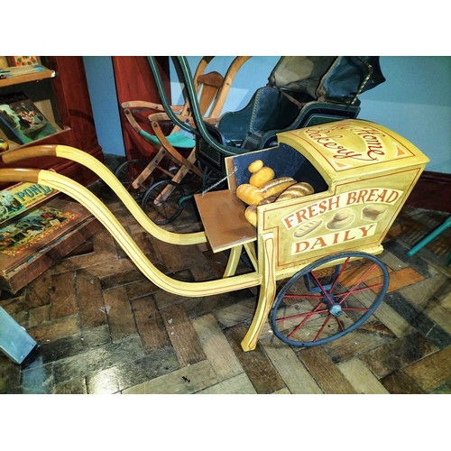 510 - ± Mr Neville's Toyshop Childs Pram and three other wheeled toys An interesting early painted wood an... 