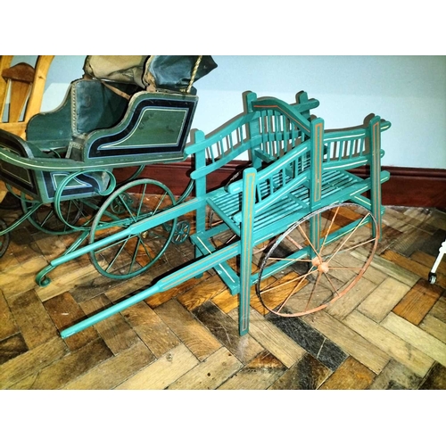 510 - ± Mr Neville's Toyshop Childs Pram and three other wheeled toys An interesting early painted wood an... 