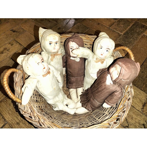 519 - ± Mr Neville's Toyshop Group of five dolls in a basket Five small soft faced dolls early C20th each ... 