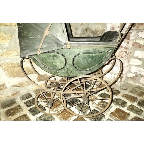 544 - ± Miss Vaughton's Sweet Shop 19th Century Toy Pram A late 19th Century Child's Toy Pram of wrought i... 