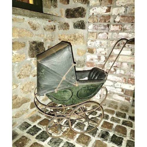 544 - ± Miss Vaughton's Sweet Shop 19th Century Toy Pram A late 19th Century Child's Toy Pram of wrought i... 