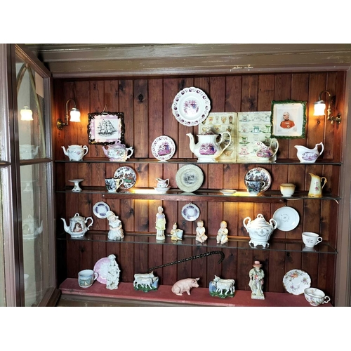 557 - ± B. Davis China & Glass The contents of the shop window A collection of pottery and porcelain to in... 