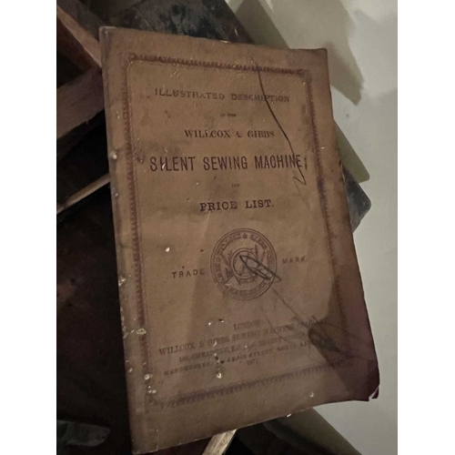564 - ± K Fillingham Milliners Workshop Four Sewing Machines A Willcox and Gibbs treadle machine with lid,... 