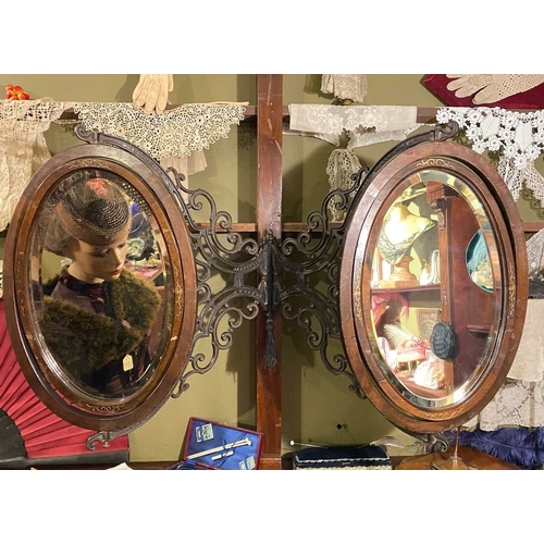 582 - ± K Fillingham Milliners A 'Scottrons Adjustable Mirror' Wall mounted swinging double mirror, ornate... 