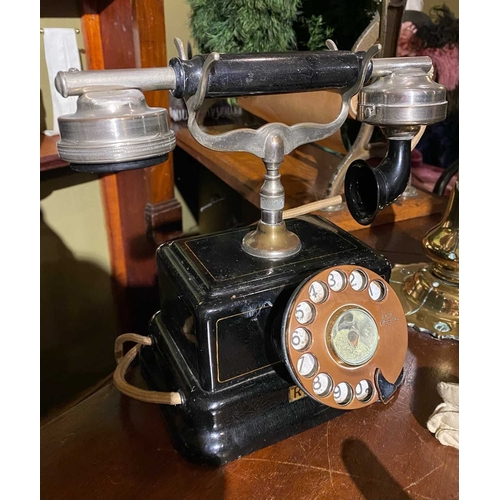 586 - ± K Fillingham Milliners A leather purse with silver mounts, a 'relay system' telephone and shop's c... 