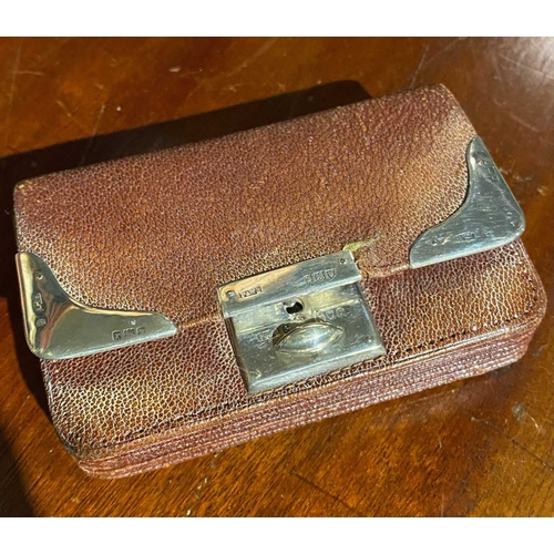 586 - ± K Fillingham Milliners A leather purse with silver mounts, a 'relay system' telephone and shop's c... 