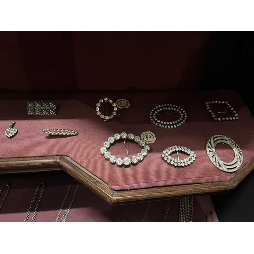 612 - ± Dotter's Jewellers & Opticians A shelf including Victorian and later jewels. To include a four pai... 