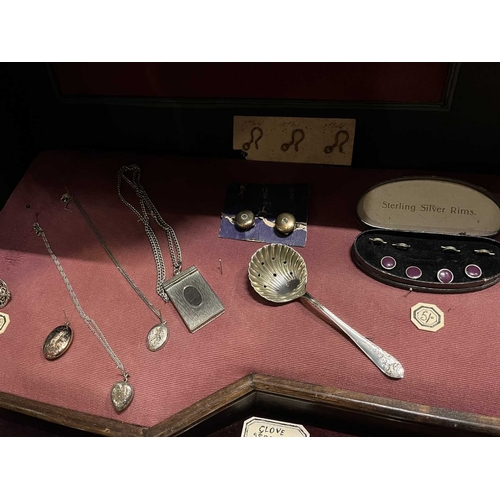 612 - ± Dotter's Jewellers & Opticians A shelf including Victorian and later jewels. To include a four pai... 