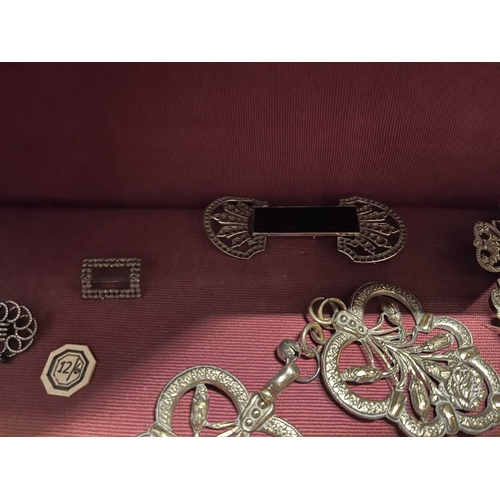 616 - ± Dotter's Jewellers & Opticians Two shelves of jewellery To include four pairs of shoe buckles, a p... 