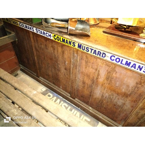 653 - ± Lugg,s Hardware Shop Counters and enamel advertising signs A mahogany topped and pine panelled cou... 