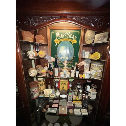 709 - ± J Dyke Apothecary Cabinet and Treasures A recessed cabinet with a locking glazed door and carved c... 