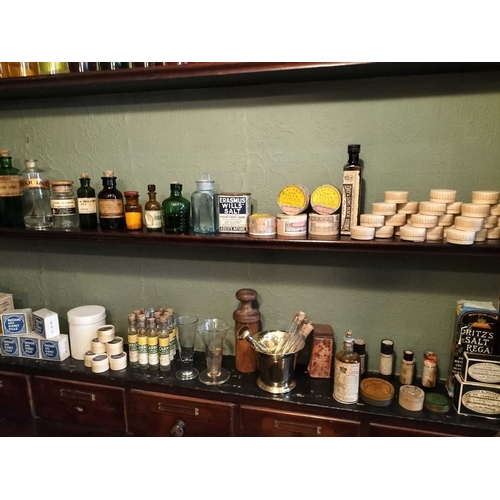 720 - ± J Dyke Apothecary Four well-filled Shelves two bottles with white glass labels 28cm, a run of gilt... 