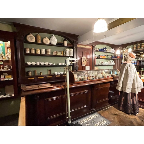 730 - ± J Dyke Apothecary The Apothecary's shop fittings with numerous drug drawers The impressesive fitti... 