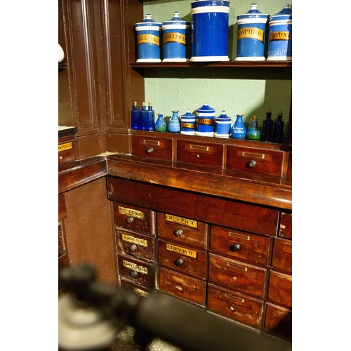 730 - ± J Dyke Apothecary The Apothecary's shop fittings with numerous drug drawers The impressesive fitti... 