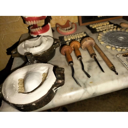 747 - ± Eli Reuben Dentist Bronze denture moulds and related items A large group of denture mould related ... 