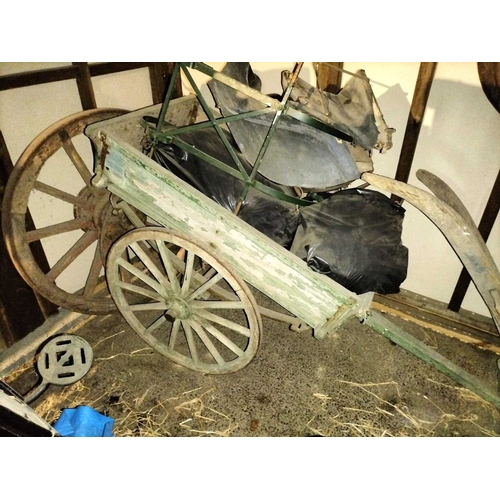 786 - ± Flambards Hotel and Coach House A painted hand cart , plough and pram. An old faded & patinated gr... 