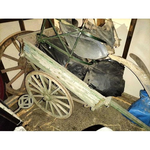 786 - ± Flambards Hotel and Coach House A painted hand cart , plough and pram. An old faded & patinated gr... 