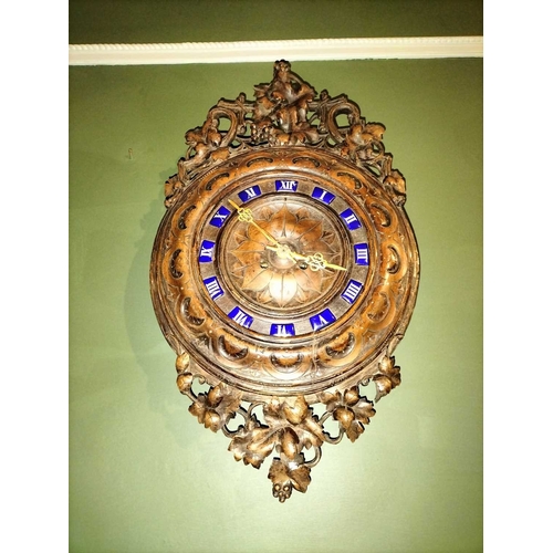 800 - ± Flambards Hotel Reception A continental wall clock With Black Forest style fruiting vine carved de... 