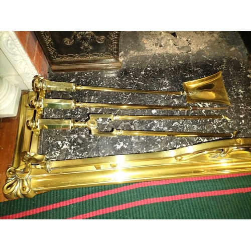 804 - ± Flambards Hotel Reception An Art Nouveau brass fender WxD 136x38cm and a set of three brass fire i... 