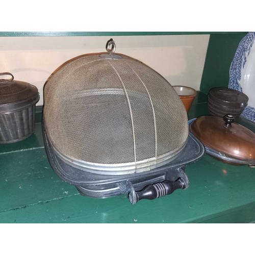 823 - ± Flambards Hotel Kitchen Two shelves of ceramics and kitchenalia A massive pewter warming meat stan... 