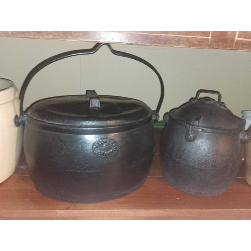 828 - ± Flambards Hotel Kitchen Cooking equipment Cast iron pots, stoneware storage jars and further items... 