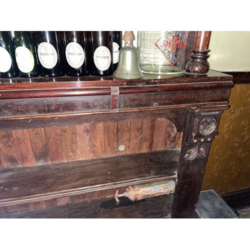 882 - ± Britain in the Blitz Mirrored Bar Back with Glass Signage A mirrored bar back with carved elements... 