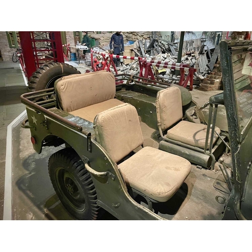 891 - ± Britain in the Blitz Willys MB Jeep A World War II period Willys MB Military Jeep with rear canvas... 