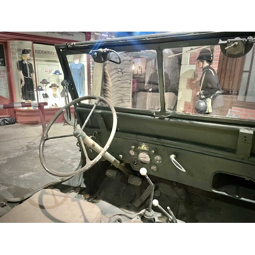 891 - ± Britain in the Blitz Willys MB Jeep A World War II period Willys MB Military Jeep with rear canvas... 