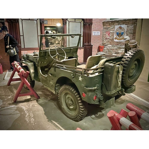 891 - ± Britain in the Blitz Willys MB Jeep A World War II period Willys MB Military Jeep with rear canvas... 