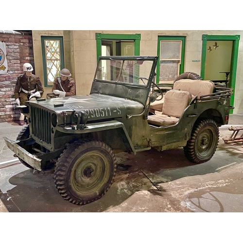 891 - ± Britain in the Blitz Willys MB Jeep A World War II period Willys MB Military Jeep with rear canvas... 