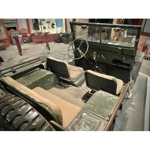 891 - ± Britain in the Blitz Willys MB Jeep A World War II period Willys MB Military Jeep with rear canvas... 