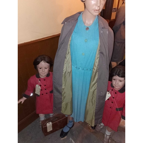 977 - ± The Station Evacuees A mother and twin girls, each with period-style clothing. - This lot will be ... 